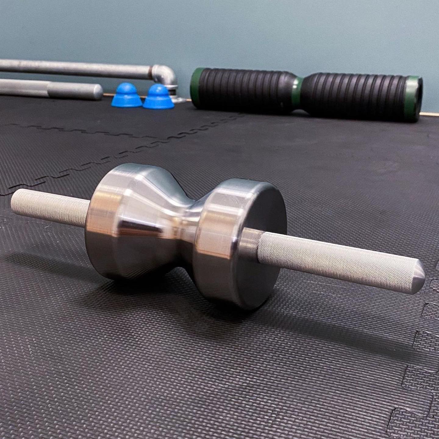 Iron Pillow soft tissue instrument with steel roller and aluminum handles